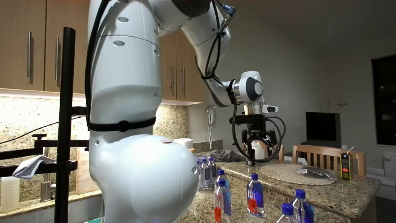 Robot arm interacting with objects in a laboratory